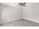 Bedroom with ceiling fan, neutral paint, and updated flooring throughout at 7144 Forest Vista St, Las Vegas, NV 89147
