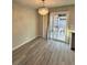 Bright dining room with sliding glass doors to the backyard and decorative lighting at 7144 Forest Vista St, Las Vegas, NV 89147