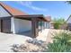 Charming home with desert landscaping, a covered carport, and a gated front entry at 7144 Forest Vista St, Las Vegas, NV 89147