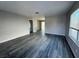 View of the living room and grey laminate wood flooring that runs throughout the home at 7144 Forest Vista St, Las Vegas, NV 89147