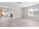 Spacious living room with access to the backyard and updated kitchen at 7144 Forest Vista St, Las Vegas, NV 89147