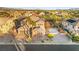 Sprawling estate with manicured grounds, a basketball court, desert landscaping, and a multi-car garage at 7258 Sashaying Spirit Ct, Las Vegas, NV 89131