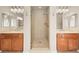 Modern bathroom with dual vanities and glass enclosed shower at 7258 Sashaying Spirit Ct, Las Vegas, NV 89131
