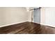 Bright bedroom featuring a barn door leading to a tiled bathroom at 7258 Sashaying Spirit Ct, Las Vegas, NV 89131