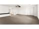 Spacious bonus room with cozy seating and large windows at 7258 Sashaying Spirit Ct, Las Vegas, NV 89131