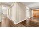 Hallway with wood floors leading to upstairs rooms and built in cabinets at 7258 Sashaying Spirit Ct, Las Vegas, NV 89131