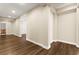 Bright hallway featuring fresh paint, modern trim, and wood-look flooring at 7258 Sashaying Spirit Ct, Las Vegas, NV 89131