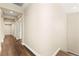 Long hallway with hardwood floors and neutral wall color at 7258 Sashaying Spirit Ct, Las Vegas, NV 89131