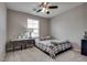 Bedroom with neutral walls, ceiling fan and a comfortable queen-size bed at 7559 Chimney Point Ct, Las Vegas, NV 89166