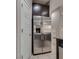Kitchen featuring a stainless steel refrigerator and dark cabinets above at 7559 Chimney Point Ct, Las Vegas, NV 89166