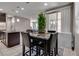 View of a cozy kitchen nook with table and chairs, and a connection to the main living area at 7559 Chimney Point Ct, Las Vegas, NV 89166