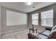 Living room with neutral walls, carpet, a projection screen and a sofa at 7559 Chimney Point Ct, Las Vegas, NV 89166