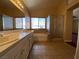 Bathroom featuring dual sinks, vanity and a separate shower at 7604 Cruz Bay Ct, Las Vegas, NV 89128