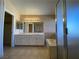 Neutral bathroom features double sinks, a large mirror, and a shower and tub at 7604 Cruz Bay Ct, Las Vegas, NV 89128