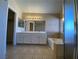 Bathroom featuring double sink vanity, bath tub and walk-in closet at 7604 Cruz Bay Ct, Las Vegas, NV 89128