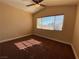 Bright bedroom featuring a ceiling fan and large window at 7604 Cruz Bay Ct, Las Vegas, NV 89128