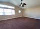 Bright bedroom with vaulted ceiling and natural light from large windows at 7604 Cruz Bay Ct, Las Vegas, NV 89128