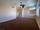 Bright bedroom with a ceiling fan and windows that provide natural light at 7604 Cruz Bay Ct, Las Vegas, NV 89128