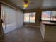 Sunny dining area with tile floor and large windows overlooking the backyard at 7604 Cruz Bay Ct, Las Vegas, NV 89128