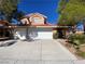 Charming two-story home with a two-car garage and low maintenance desert landscaping at 7604 Cruz Bay Ct, Las Vegas, NV 89128