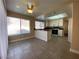 Eat in kitchen featuring granite countertops and tile flooring at 7604 Cruz Bay Ct, Las Vegas, NV 89128