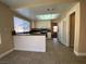 Bright kitchen featuring tiled floors, white cabinets, granite counters, and modern appliances at 7604 Cruz Bay Ct, Las Vegas, NV 89128