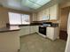 Kitchen with white cabinets, granite countertops, and stainless steel appliances at 7604 Cruz Bay Ct, Las Vegas, NV 89128