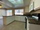 Open kitchen featuring granite countertops, stainless steel appliances, and tile flooring at 7604 Cruz Bay Ct, Las Vegas, NV 89128