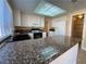 Kitchen with granite countertops, white cabinetry, and stainless steel appliances at 7604 Cruz Bay Ct, Las Vegas, NV 89128