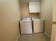 Functional laundry room equipped with a washer, dryer, and additional storage at 7604 Cruz Bay Ct, Las Vegas, NV 89128