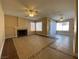 Large living room with a fireplace and sliding glass door at 7604 Cruz Bay Ct, Las Vegas, NV 89128