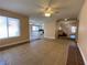 Open floor plan featuring tile floors, a staircase, and views into the kitchen at 7604 Cruz Bay Ct, Las Vegas, NV 89128