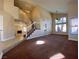 Inviting living room featuring high ceilings, neutral tones, plush carpeting, and a staircase at 7604 Cruz Bay Ct, Las Vegas, NV 89128