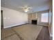 Inviting living room with fireplace, tile floors, and ample natural light from the window at 7604 Cruz Bay Ct, Las Vegas, NV 89128