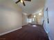 Spacious living room features vaulted ceilings, neutral paint, plush carpet and bright views at 7604 Cruz Bay Ct, Las Vegas, NV 89128
