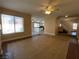 Open floor plan with tile flooring and a view to the kitchen and staircase at 7604 Cruz Bay Ct, Las Vegas, NV 89128