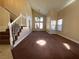 Cozy living room with carpet flooring, high ceilings, and natural light from large windows at 7604 Cruz Bay Ct, Las Vegas, NV 89128