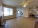 Open floor plan featuring tile floors, a staircase, and views into the kitchen at 7604 Cruz Bay Ct, Las Vegas, NV 89128