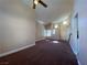 Bright living area with neutral tones, carpet flooring, and stylish lighting fixtures at 7604 Cruz Bay Ct, Las Vegas, NV 89128