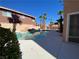 Backyard pool featuring mature palm trees in a private backyard at 7604 Cruz Bay Ct, Las Vegas, NV 89128