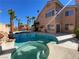 Beautiful backyard featuring a sparkling pool and lush tropical landscaping at 7604 Cruz Bay Ct, Las Vegas, NV 89128