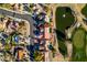 A marked house in an aerial view of a residential area with a pond and golf course at 8713 Litchfield Ave, Las Vegas, NV 89134