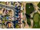Captivating aerial view of a residential area with a pond, golf course and picturesque streets at 8713 Litchfield Ave, Las Vegas, NV 89134