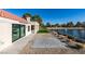 Exterior view showing the landscaped backyard with a patio and pond at 8713 Litchfield Ave, Las Vegas, NV 89134