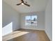Clean, bright room with wood floors and large window overlooking the grounds at 8713 Litchfield Ave, Las Vegas, NV 89134