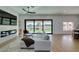 Living room has a modern fireplace, hardwood floors and sliding glass doors at 8713 Litchfield Ave, Las Vegas, NV 89134