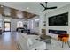 Bright living room with wood ceiling, hardwood floors, and modern fireplace at 8713 Litchfield Ave, Las Vegas, NV 89134