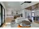 Expansive open living area featuring a modern kitchen, modern lighting, contemporary furniture, and modern design at 8713 Litchfield Ave, Las Vegas, NV 89134