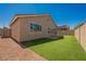 Exterior backyard view with gravel, artificial grass, and block wall at 909 Trinity Pond Cir, Henderson, NV 89002