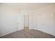 Spacious bedroom featuring neutral carpet, closet, and white trim at 909 Trinity Pond Cir, Henderson, NV 89002
